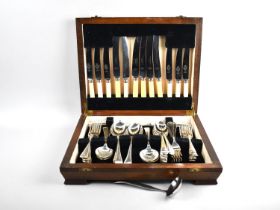 A Mid 20th Century Oak Cased Canteen Containing Mixed Cutlery