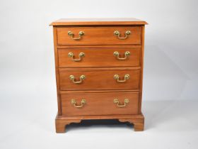 A Modern Chest of Four Drawers with Brass Handles, Of Diminutive Form, 57cms Wide by 40cms Deep