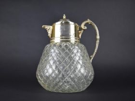 A Silver Plate Mounted Glass Claret Jug with Scrolled Handle and Foliate Motif Lipped Spout, 26cm