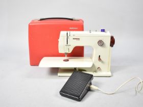 A Mid/Late 20th Century Bernina Electric Sewing Machine with Power and Foot Cable