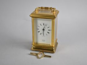 A Modern Gilt Brass Carriage Clock with White Enamelled Dial Inscribed St. James, London, With Key