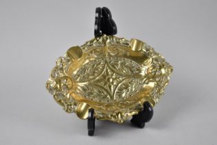 A Cast French Brass Oval Ashtray with Relief Decoration, 18cms Wide