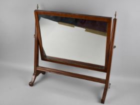 A Mahogany Framed Swing Toilet Mirror, 55cms Wide