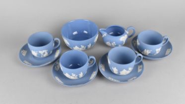 Four Wedgwood Blue Jasperware Cups and Saucers Together with a Milk Jug and Sugar Bowl