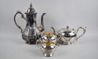 A Silver Plated Britannia Metal Three Piece Tea Service together with a Coffee Pot by James Dixon