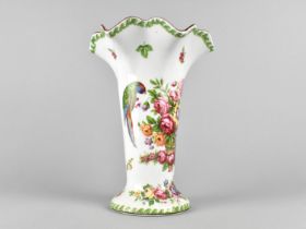 A Continental Vase with Wavy Rim Decorated with Basket of Flowers and Parrots, 24cm high