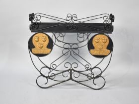 A Mid 20th Century Wrought Iron Planting Stand Having Two Reproduction Salop Fire Insurance Plaques,