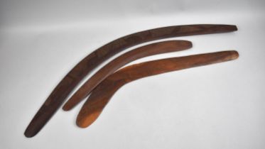 A Set of Three Aboriginal Souvenir Boomerangs with Carved Decoration Depicting Game