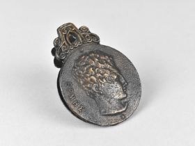 A Patinated Cast Brass Letter Clip Decorated in Relief with Hercules, 6cms Diameter