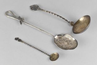 A Continental Silver Ladle with Twist Handle and Maltese Cross Motif Finial Together with a White