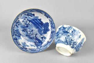 An Early English Soft Paste Blue and White Transfer Printed Tea Bowl and Saucer with Oriental