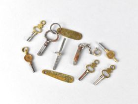 A Collection of Various 19th Century Clock Keys together with Two Brass Tag Fobs, One Inscribed