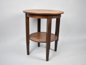 A Circular Occasional Table with Stretcher Shelf, 54.5cms Diameter