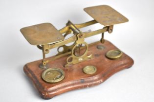 A Set of Edwardian Brass Postage Scales with Weights, Mahogany Serpentine Plinth, 17cms Wide