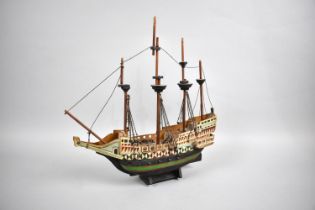 A Sailor's Handmade and Painted Wooden Model of a Four Masted Tall Ship, 33cms Long