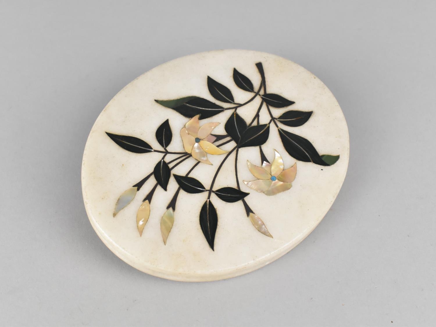 An Italian Pietra Dura Inlaid Oval Marble Disc, 14cms by 11.5cms