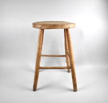 A Mid 20th Century Oval Topped Stool on Turned Supports, 53cms High