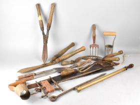 A Collection of Various Wooden Handled Garden Tools to include Shears, Saw, Plot Measure Etc