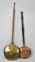 An Early 19th Century Brass Bed Warming Pan with Iron Handle together with a Later Copper Example