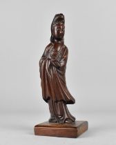 A Carved Wooden Figure of Guanyin on Square Plinth Base, 18cms High