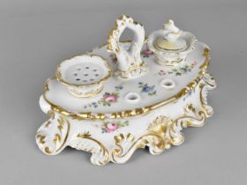 A 19th Century Oval Porcelain Inkstand with Fitted Section for Powder, Ink and Pens Raised on