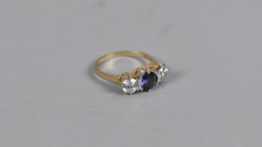 A 9ct Gold Mounted and CZ/Paste Trilogy Ring, 2.7gms, Size O