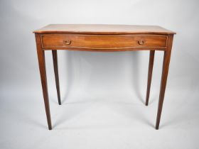 An Edwardian Serpentine Front Side Table with Single Long Drawer on Tapering Square Supports,