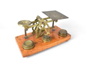 An Edwardian Set of Brass Postage Scales with Weights on Rectangular Wooden Plinth Base, 21cms Wide