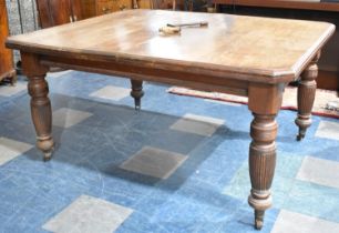 An Edwardian Wind Out Dining Table with Two Extra Leaves, Turned Reeded Supports Culminating in