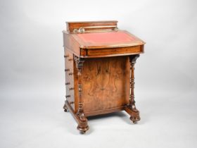 A 19th Century Burr Walnut Davenport with Sloping Lid Having Tooled Leather Writing Inset to