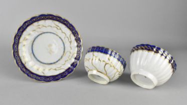 An 18th/19th Century Worcester Tea Bowl and Saucer of Reeded Form Decorated with Cobalt Blue Inset