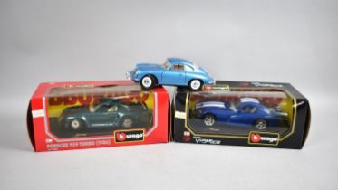 Two Boxed Burago Diecast Sports Cars and an Unboxed Model of a Porsche