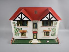 A Vintage Wooden Dolls House with Later Furniture, 61cms Wide