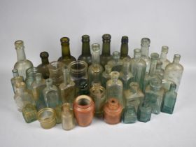 A Collection of Various Vintage Glass Bottles and Pots etc