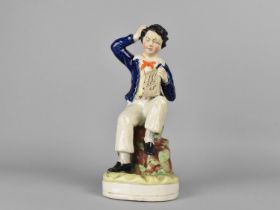 A Staffordshire Figure, School Boy with Tablet Confused with Addition, 23cm high