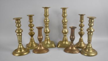 A Collection of Four Pairs of 19th Century Brass Candlesticks, All with Pushers, Talles 27.5cms High