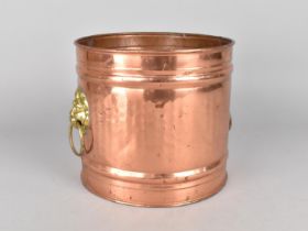 A Modern Circular Copper Plant Pot Holder with Brass Lion Mask Handles, 18cms Diameter and 17cms