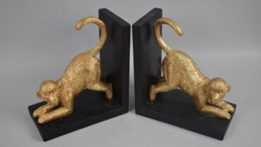 A Pair of Modern Bookends Decorated with Gilt Monkeys, 18cms Long and 20cms High