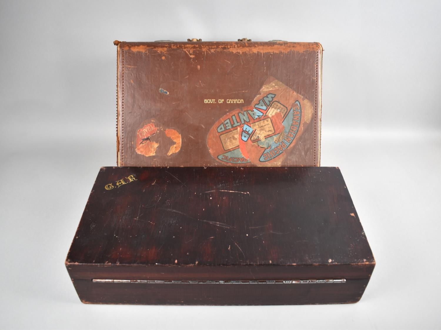 A Vintage Leather Document Case for the Govt. of Canada together with a wooden bo monogrammed C.A.R.