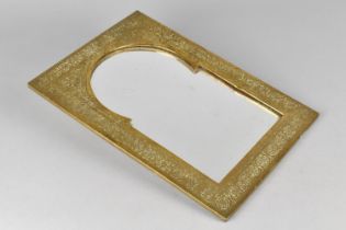 A Souvenir Islamic Brass Wall Hanging Mirror with Engraved Decoration, 31cms by 22cms