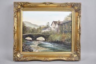 A Gilt Framed Oil on Canvas, Signed Ann Celio, Depicting Highland Bridge Over River Beside Cottages,