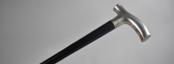 A Late Victorian Ebonized Walking Cane with Silver Handle having Hinged End Cap Giving Access to