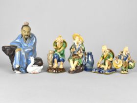 A Chinese 'Mudmen' Figure Depicting Seated Man with Goose, 16cm high Together with Smaller Chinese