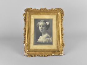 A Vintage Easel Back Gilt Photo Frame Containing Black and White Photographs of a Young Girl,