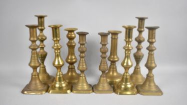 A Collection of Five Pairs of 19th Century and Later Brass Candlesticks