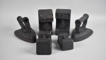 A Collection of Four Cast Iron Scale Weights and Two Flat Irons