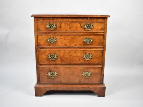 A Reproduction Burr Wood Chest of Four Graduated Long Drawers with Brushing Slide Over, Of