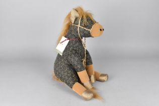 A Modern Gem Door Stop in the Form of a Seated Horse, 33cms High