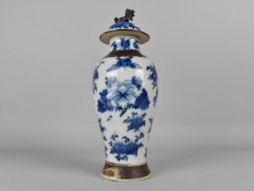 A Chinese Blue and White Nanking Crackle Glazed Baluster Vase and Cover Decorated with Blossoming