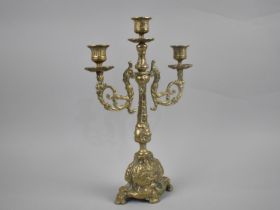 A Cast Brass Three Branch Candelabra, 35cms High